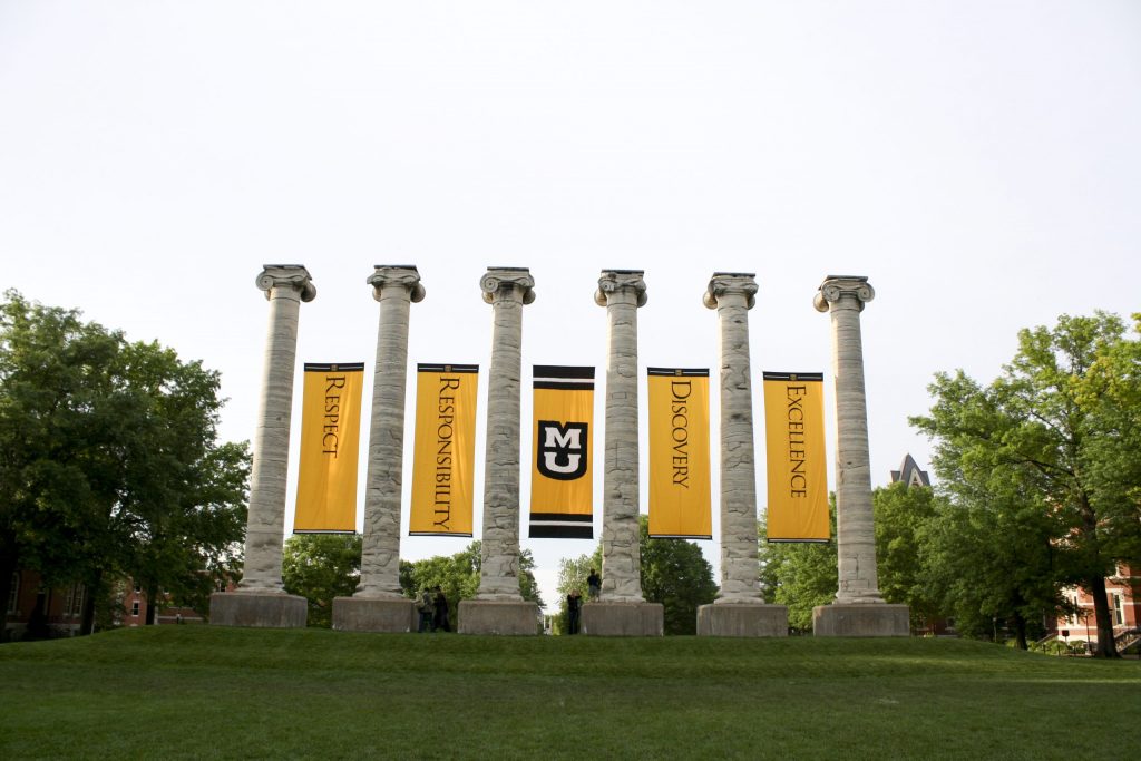 Mizzou columns with "respect, responsibility, discovery, excellence" banners between